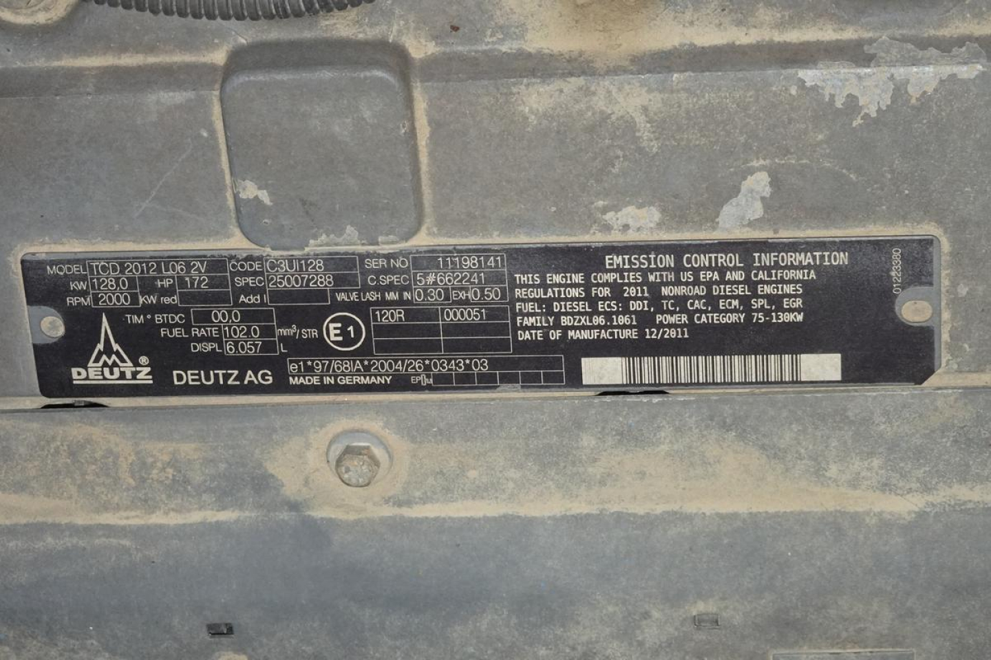 Emissions control information plate on Terex MHL340D showing model TCD 2012, serial numbers, brands (Deutz, Deutzag?), and various engine and emission codes.