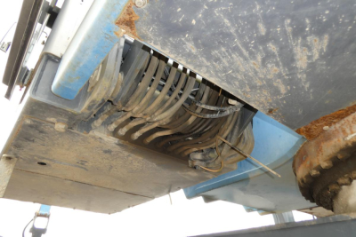 Underbody view of 2012 Terex MHL340D showing hydraulic hoses and wiring harness in the chassis area.