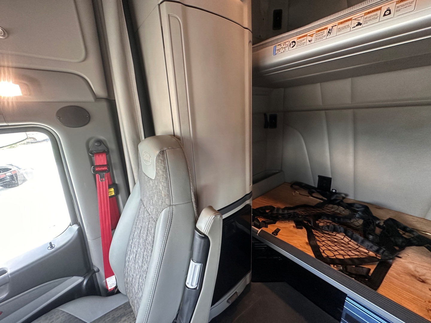Peterbilt 579 truck cab interior with sleeper bunk area and seat visible