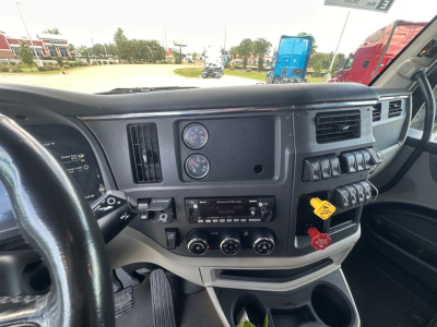 Peterbilt 579 truck interior dash and controls with gauges and switches visible