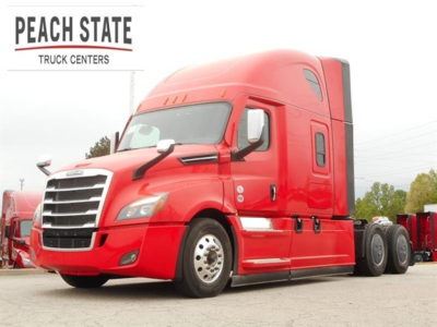 Freightliner Cascadia 126 tractor in red with Peach State Truck Centers logo.