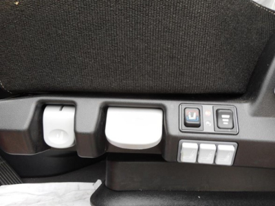 Cab view showing control panel and seat adjustment buttons in Freightliner Cascadia sleeper truck interior.