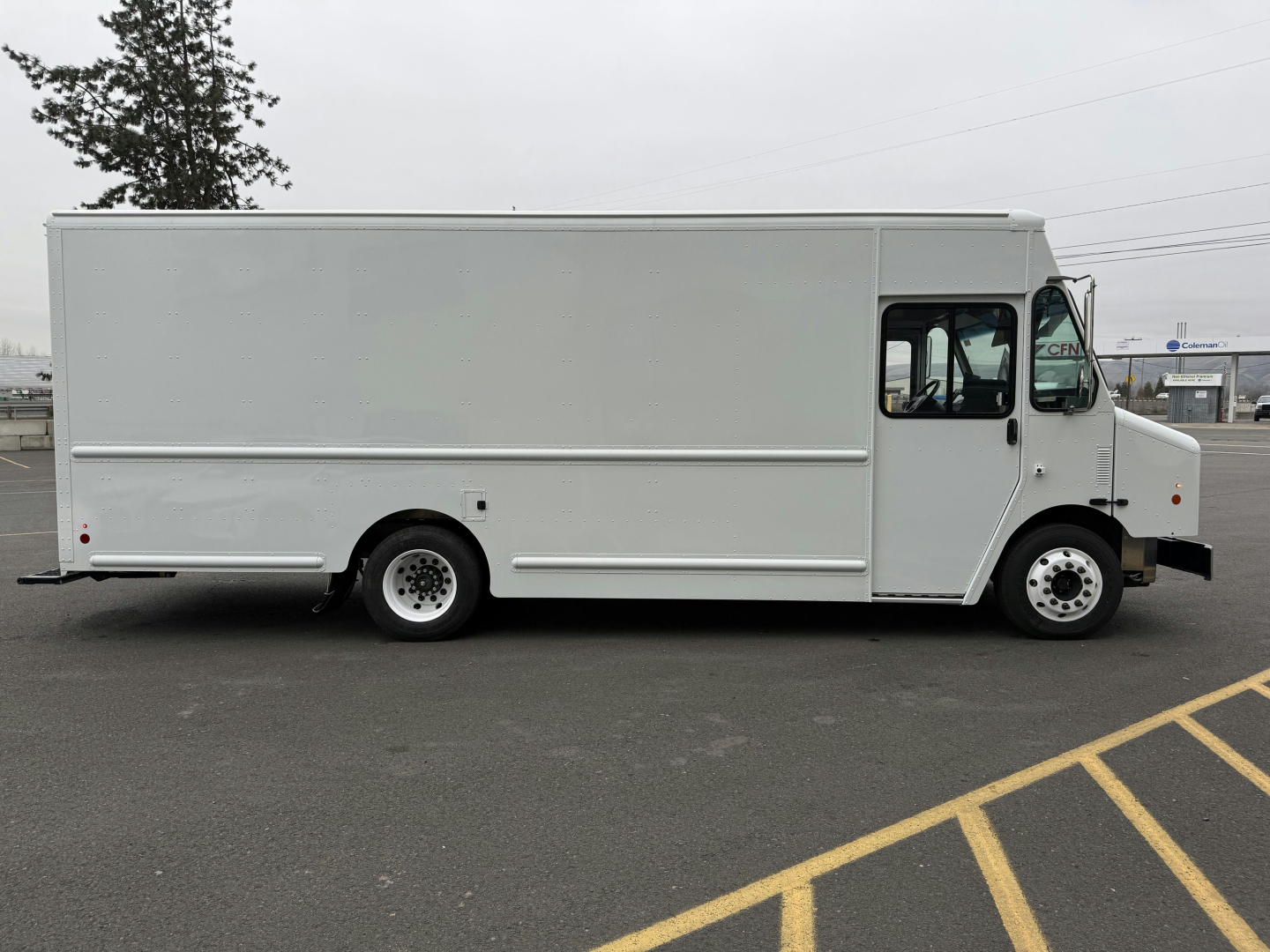Harbinger S635 cab and chassis truck side view showing cargo box and cab with front wheel, VIN tag not visible.