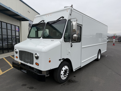 Harbinger S635 cab and chassis truck white front-left view showing cab, side cargo box, grille, headlights, and dual rear wheels.