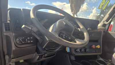 Interior of a 2019 International LT625 Daycab showing steering wheel and instrument cluster with Cummins engine badge area.