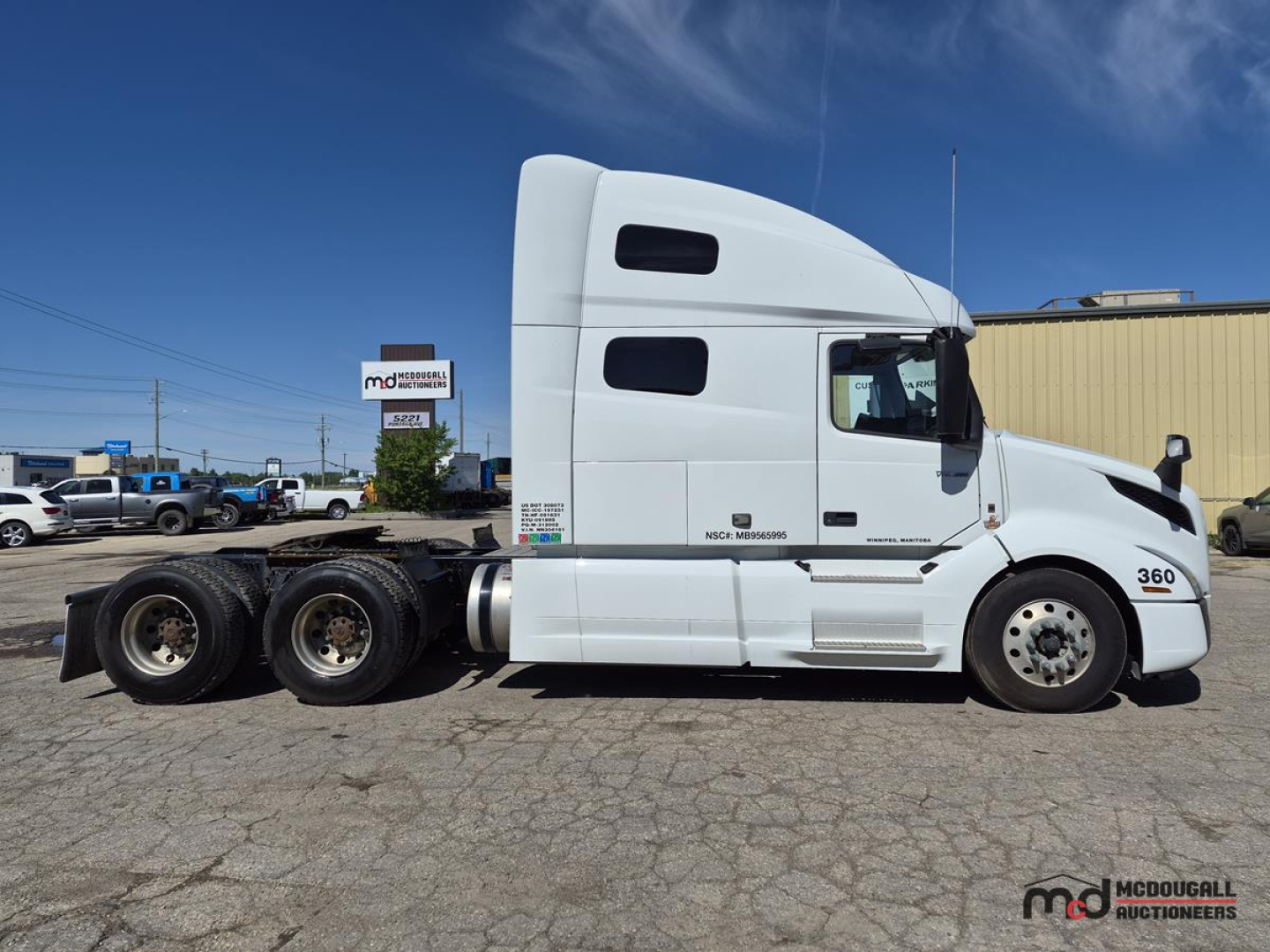 Volvo VNL760 tractor-trailer side view showing cab and chassis with 6 wheels on rear axle and white paint.