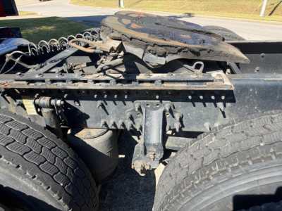 Volvo VNL64T760 tractor rear-axle area showing fifth wheel mounting, hoses, and suspension components.