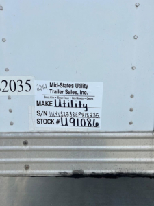 Tag on trailer showing Make Utility, S/N UYVS5358EP818235, STOCK # U91086, Mid-States Utility Trailer Sales, Inc. 2014