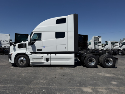 Truck side view showing a white 2027 Mack PR64T76H tractor with sleeper cab, chassis and wheels visible.