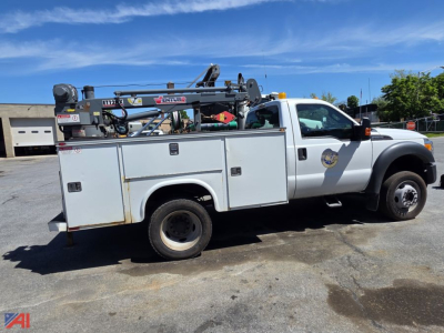 2014 Ford F550 Super Duty utility truck in service/utility category, side view showing utility bed with mounted crane and compartments.
