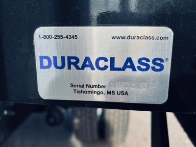 Duraclass plate on 2025 Mack MD6 showing serial number and contact details.