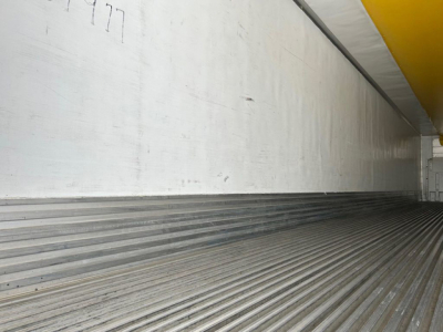Trailer interior cargo area of a 2019 Utility Reefer showing aluminum walls and ribbed floor.
