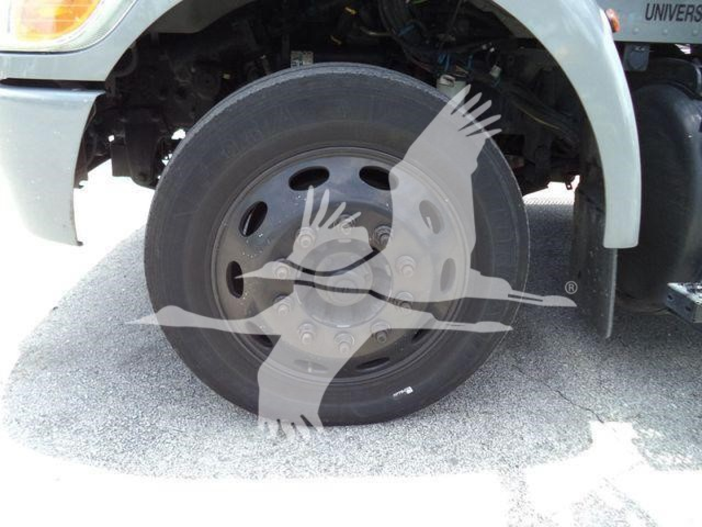 Peterbilt 337 rollback truck front wheel and fender with wheel hub and tire visible