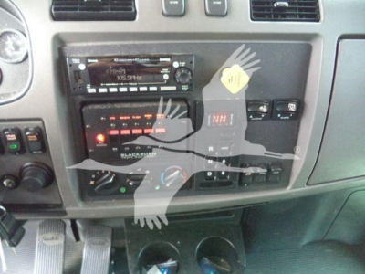Dashboard area of a 2021 Peterbilt 337 rollback truck showing radio and control panels with various switches and knobs.