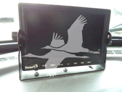 In-dash monitor displaying a Buyer's logo with a seagull graphic; several buttons labeled MENU and CH1 CH2 CH3 along bottom edge.