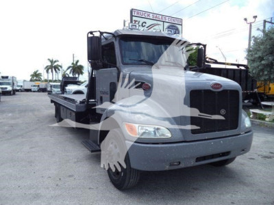 Peterbilt 337 rollback truck front-left view showing cab and flatbed with VIN 2NP2HM6XXMM759575 and stock number T59575.