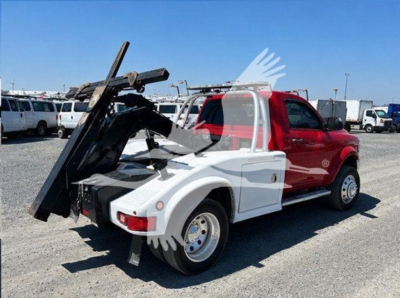 Ram 4500 SLT tow truck side view showing winch and flatbed inoperative bed