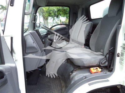 Isuzu NPR-XD truck cab interior showing front seats and steering wheel.