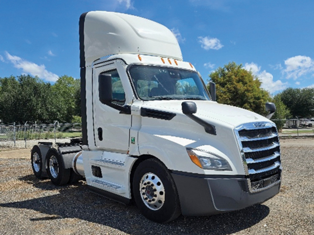 Truck cab: 2023 Freightliner Cascadia126 in white, CONVENTIONAL DAYCAB with sleeper height, front grille, headlights, and two-axle rear chassis visible; stock tag visible.