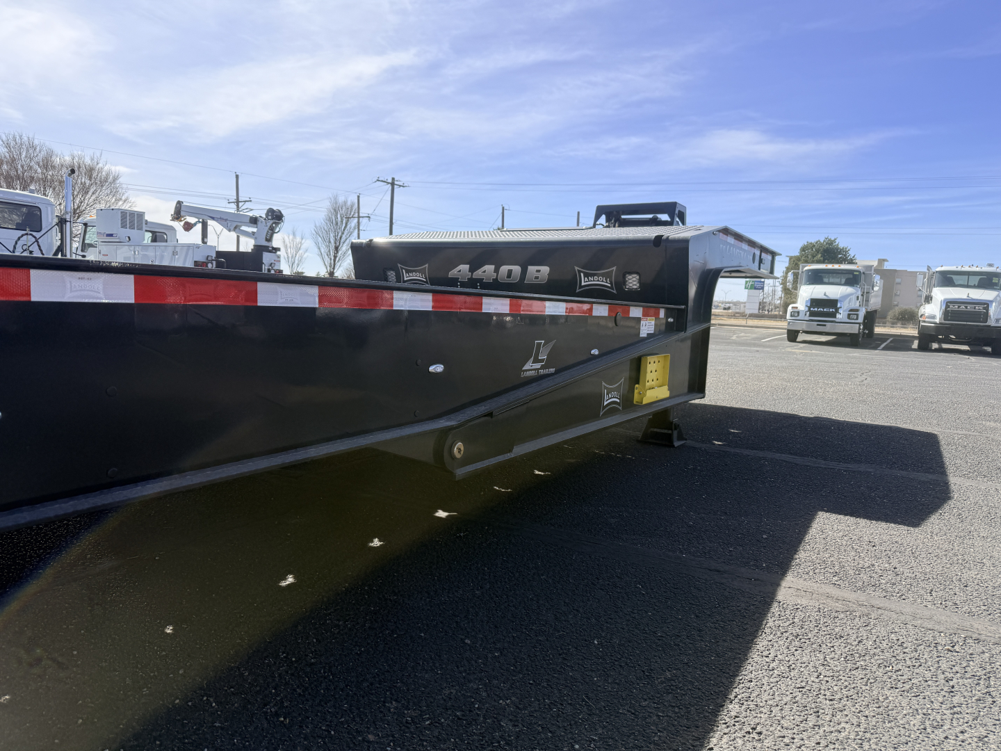 Landoll 440B-53 40 Ton traveling axle lowboy trailer side view showing model label and reflective tape