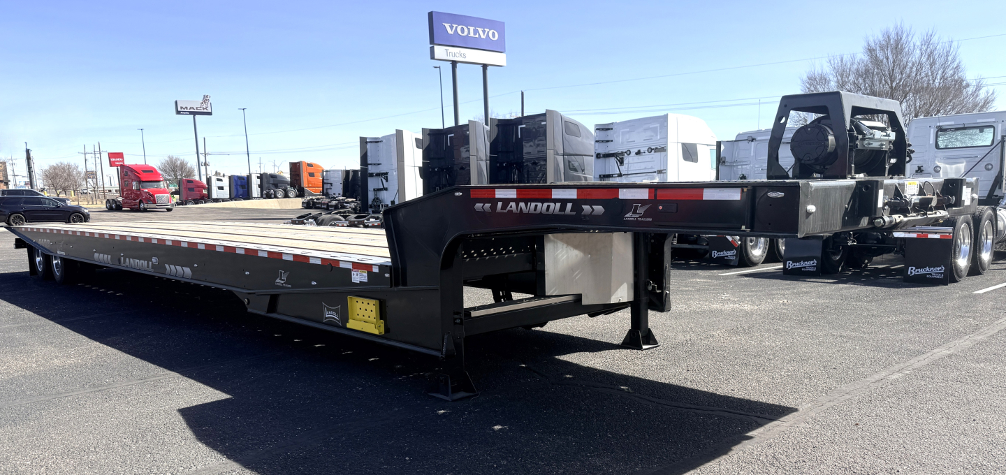 Landoll 440B-53 40-ton traveling axle lowboy trailer in a dealership lot.