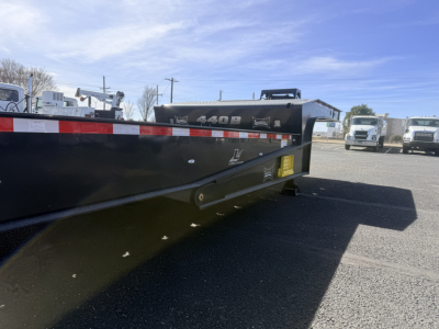 Landoll 440B-53 40 Ton traveling axle lowboy trailer side view showing model label and reflective tape