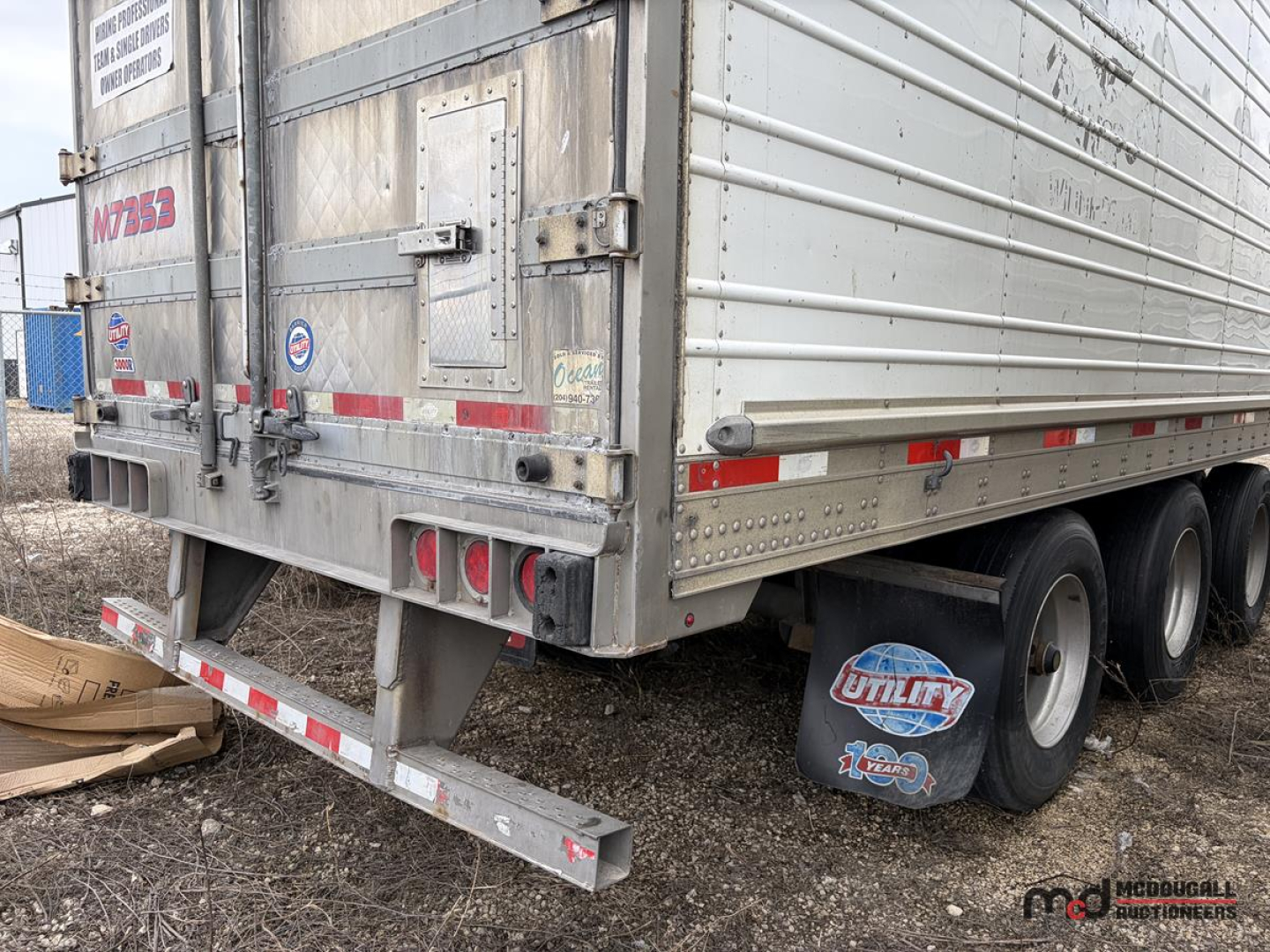 Reefer trailer rear and side view showing 3-axle configuration, aluminum exterior, rear doors, bumper, and mud flaps with Utility logo.