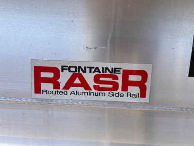 Fontaine BASR sticker on aluminum surface with text 'Fontaine BASR Routed Aluminum Side Rail' and grey/metal background.