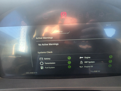 Kenworth T880 dashboard display showing active warnings and systems check; text includes 'Active Warnings', 'No Active Warnings', 'Systems Check', 'Battery', 'Engine', 'Transmission', 'DEF System', 'Fuel System', 'Engine Oil', and a trip re