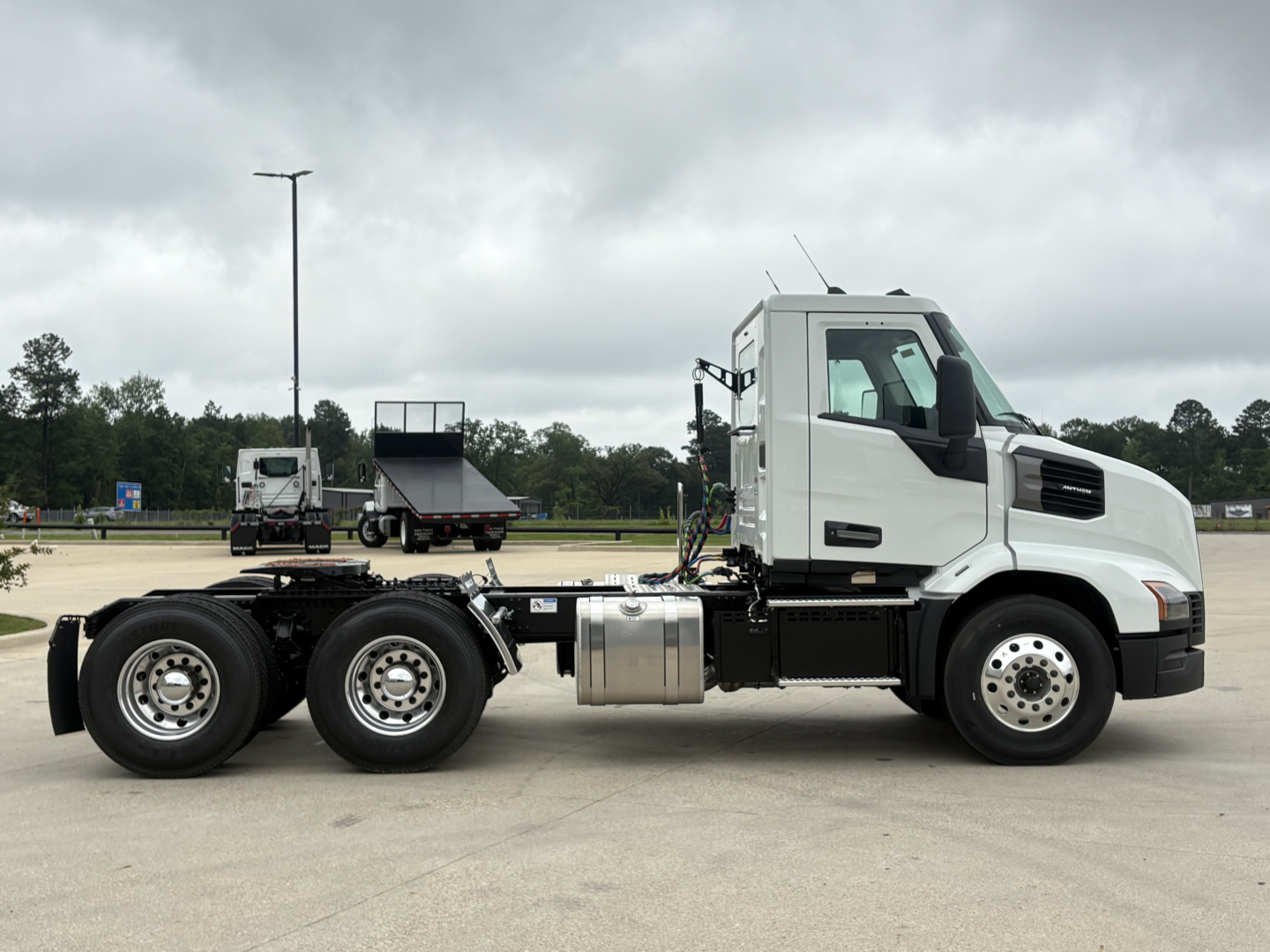 Mack AN64T truck side view showing tractor cab and chassis with fuel tank and dual rear axles.