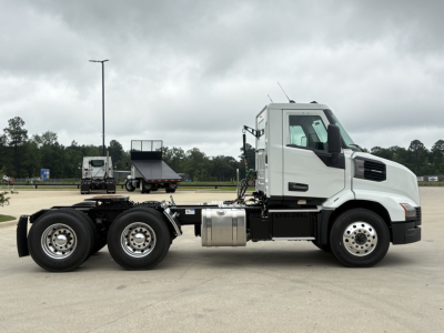 Mack AN64T truck side view showing tractor cab and chassis with fuel tank and dual rear axles.