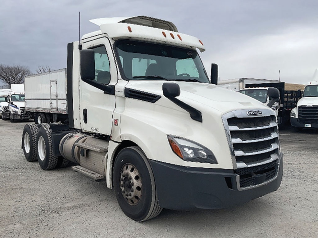 Freightliner Cascadia126 tractor-trailer showing front and side view with white cab and sleeper, grille, headlights, and dual rear axles.