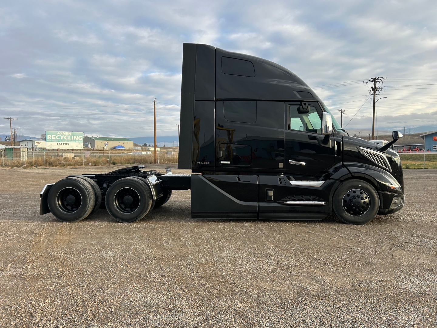 Volvo VNL64T660 tractor unit side view showing cab and chassis with sleeper, black paint, no visible decals.