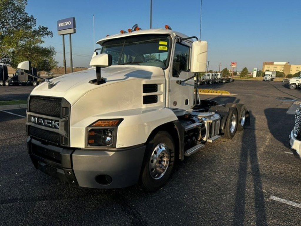 Mack Anthem cab and chassis truck in a parking lot showing front grille with MACK emblem and large side mirrors.