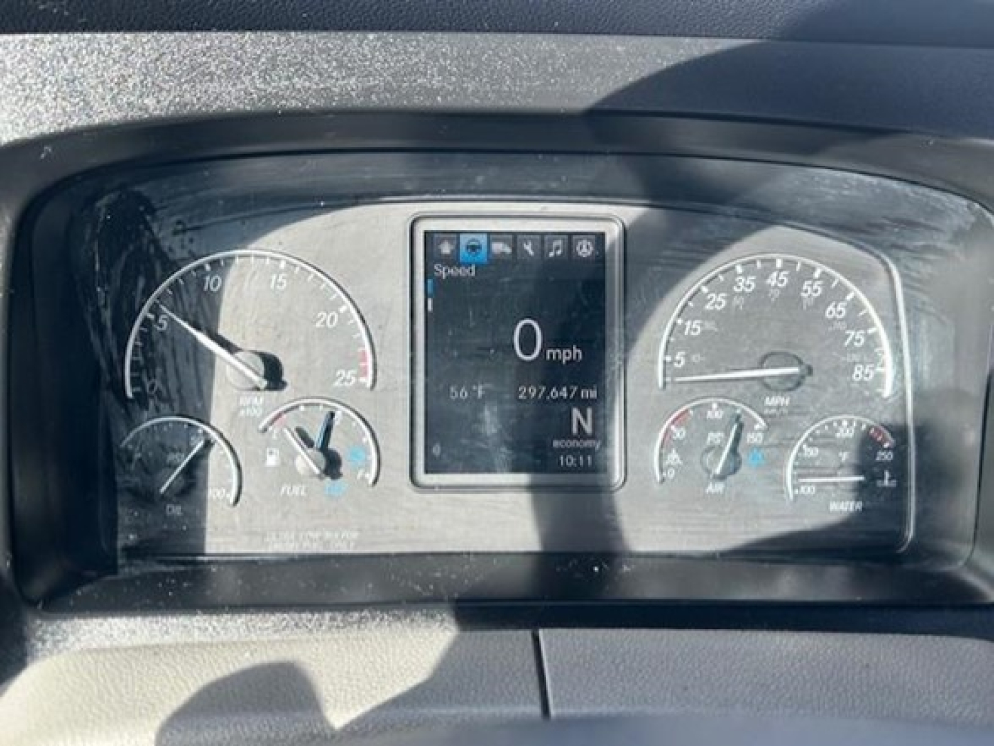Dashboard of a 2021 Freightliner Cascadia 126 showing gauge cluster with center digital display, speed 0 mph, and various indicators.