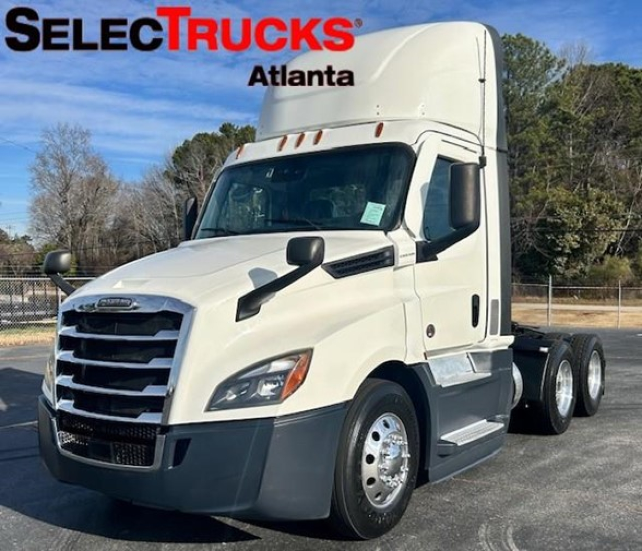 Freightliner Cascadia 126 day cab truck in white, front three-quarter view, SelectTrucks Atlanta watermark, V-shaped grille, sleeper cab, side mirrors, dual rear axles.