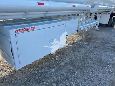 Trough bottom Petro Tank trailer side panel with 'FIRE EXTINGUISHER INSIDE' label and structural compartments visible.