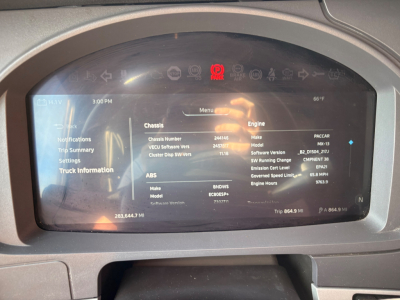 Kenworth T680 dash display showing vehicle information and diagnostic readout.