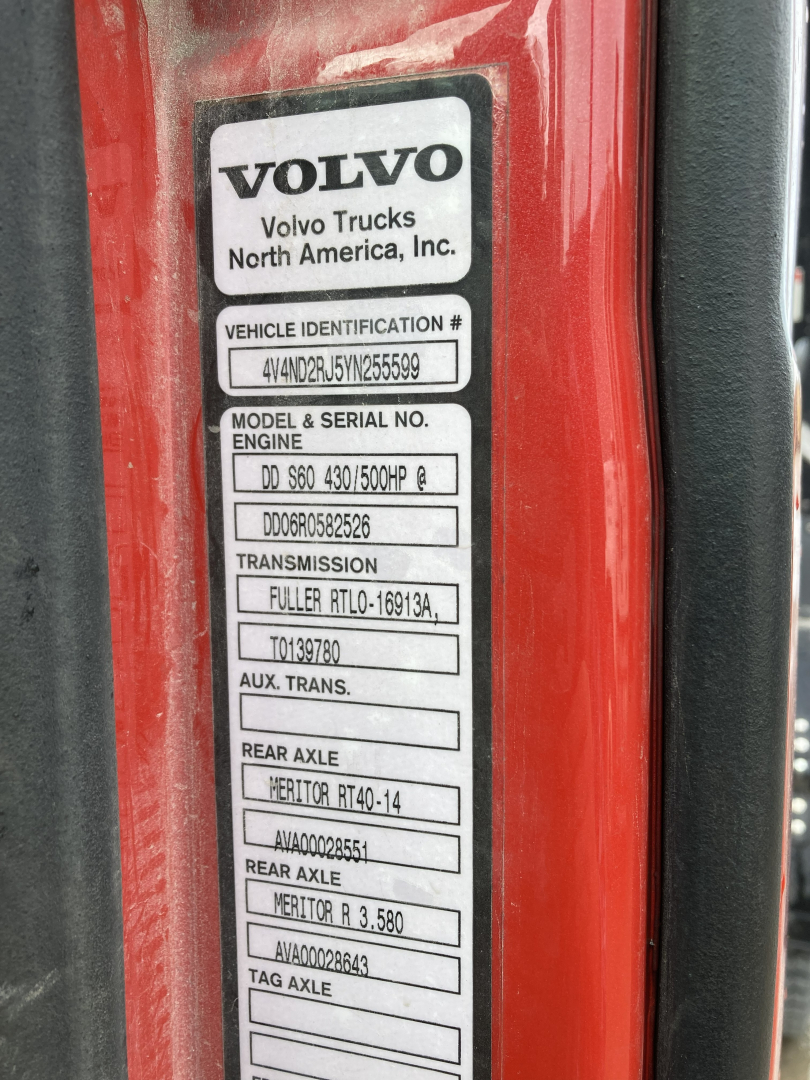 Volvo DD S60 truck door badge showing Vehicle Identification Number and model/serial labels with engine, transmission, rear axle data.