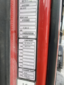 Truck information label on Volvo S60 showing axle weights, cab data, and paint codes; includes fields for tag axle, front axle, cab, cab paint, and chassis paint.