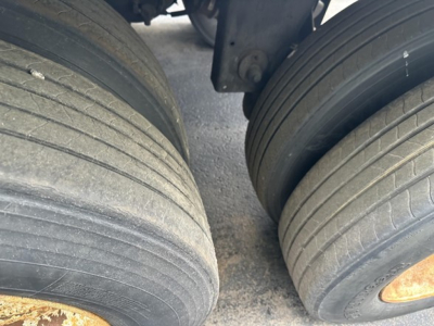 Trailer axle view showing dual rear tires of a 2018 Utility 3000R trailer in service condition with no visible damage.