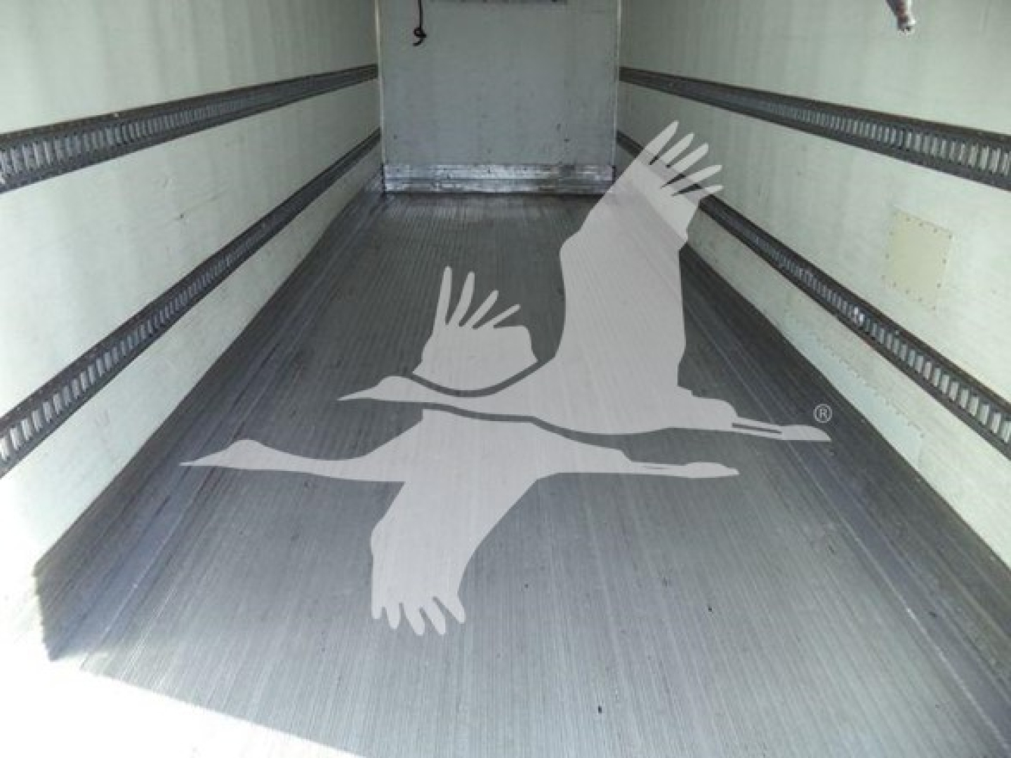 Trailer cargo area of a refrigerated 2019 International Durastar 4300 showing interior walls and floor.