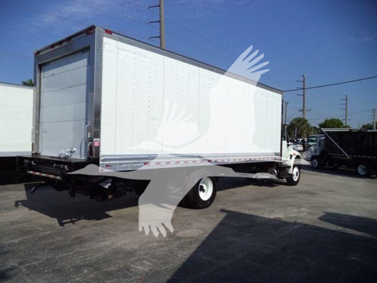 International Durastar 4300 refrigerated truck with box, side view showing cargo area and rear hitch.