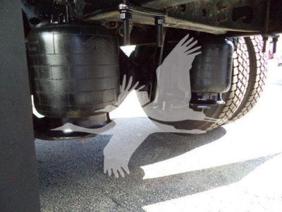 Truck image showing underside of a refrigerated 2019 International Durastar 4300 with twin undercarriage tanks and wheels visible.