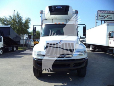 Truck front view of a 2019 International Durastar 4300 refrigerated truck with white cab and attached refrigeration unit on top.