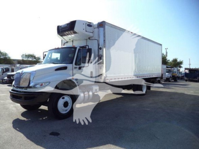 International Durastar 4300 refrigerated box truck in serviceable condition with side refrigeration unit mounted on cab and long box trailer.