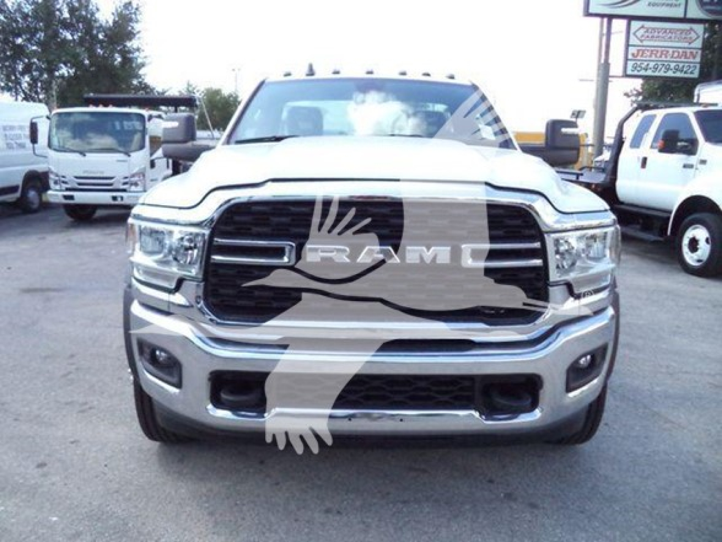 Ram 5500 front view showing chrome grille with RAM emblem, headlights, and bumper; text overlay watermark across image.