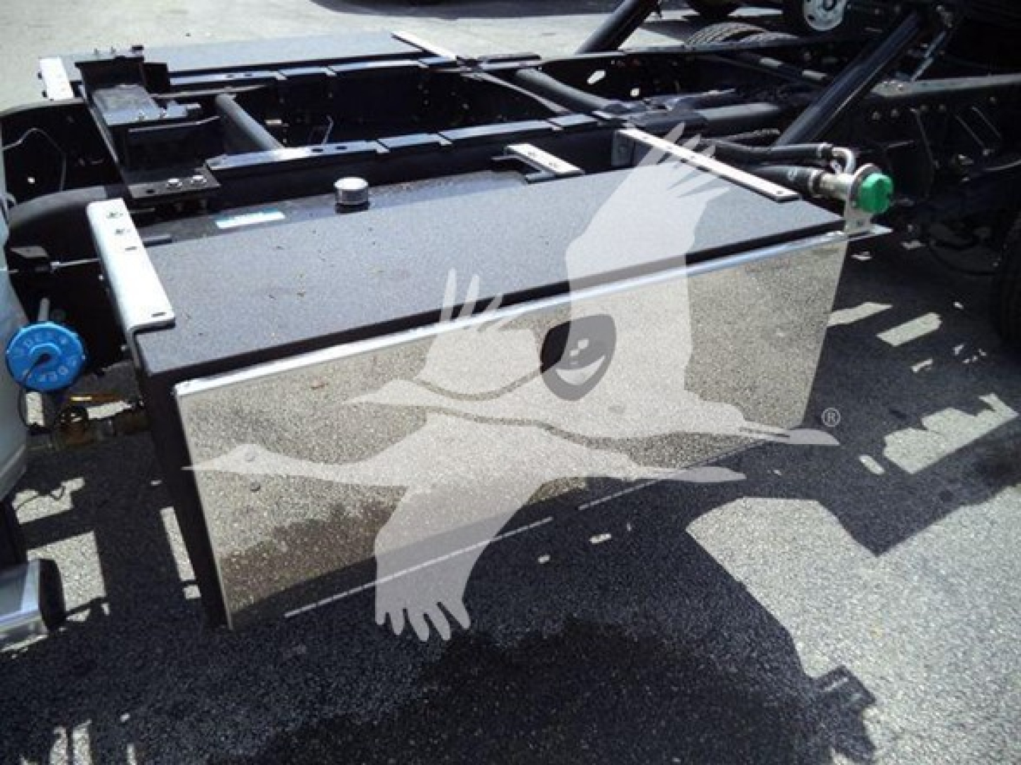 Ram 5500 chassis with fuel tank and mounting hardware; visible labels and fittings.