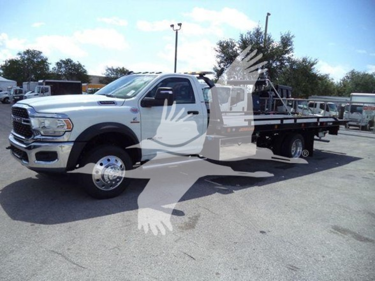 Ram 5500 SLT tow truck/rollback with flatbed, white cab, dual rear wheels, chrome front grille, VIN 3C7WRMDL0RG240687 overlay watermark.