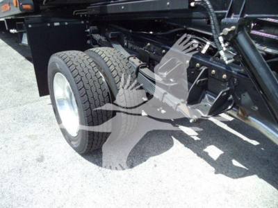 Ram 5500 truck chassis with dual rear wheels and suspension components visible under the frame.